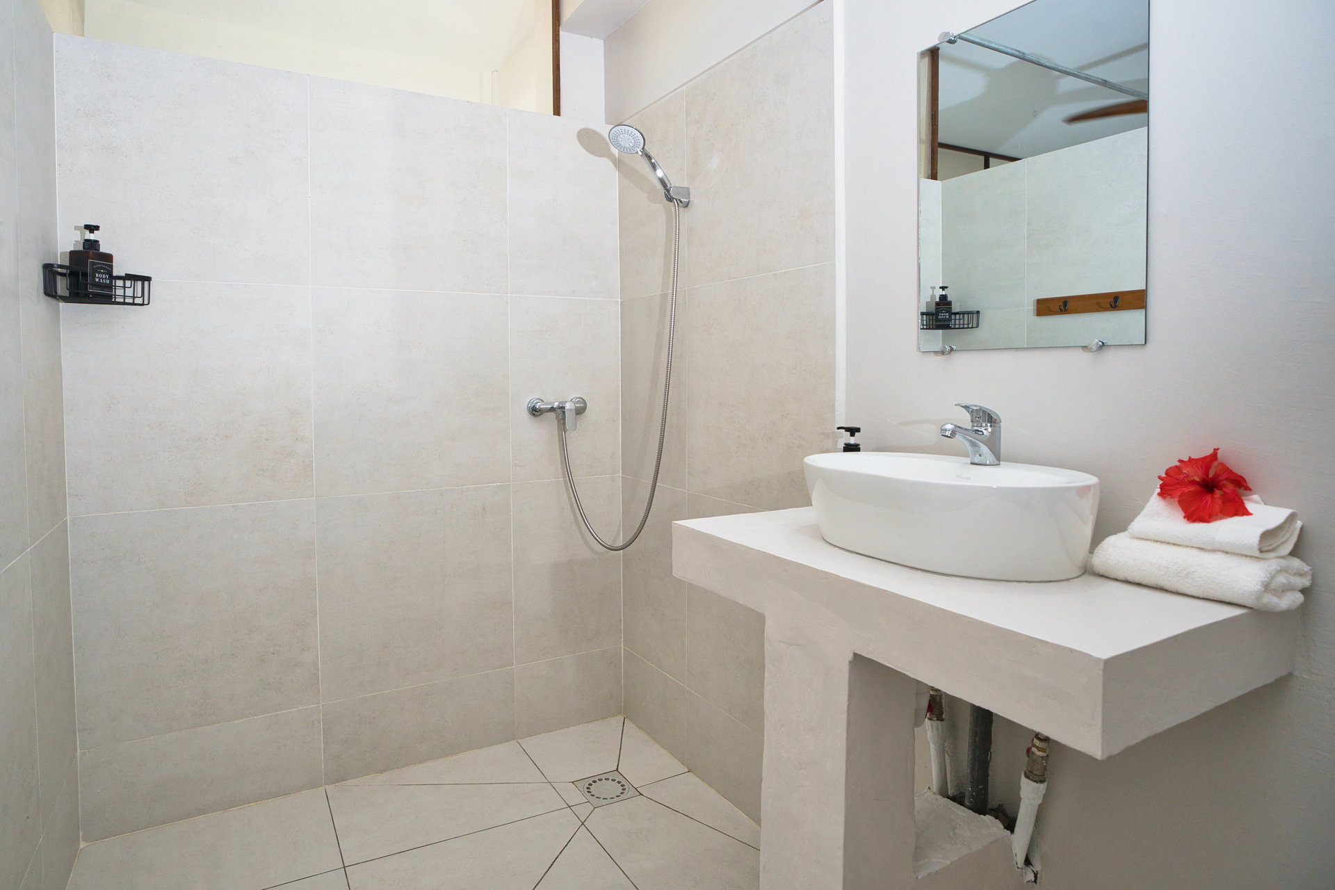 Studio with Ocean View en-suite bathroom with tiled shower and basin