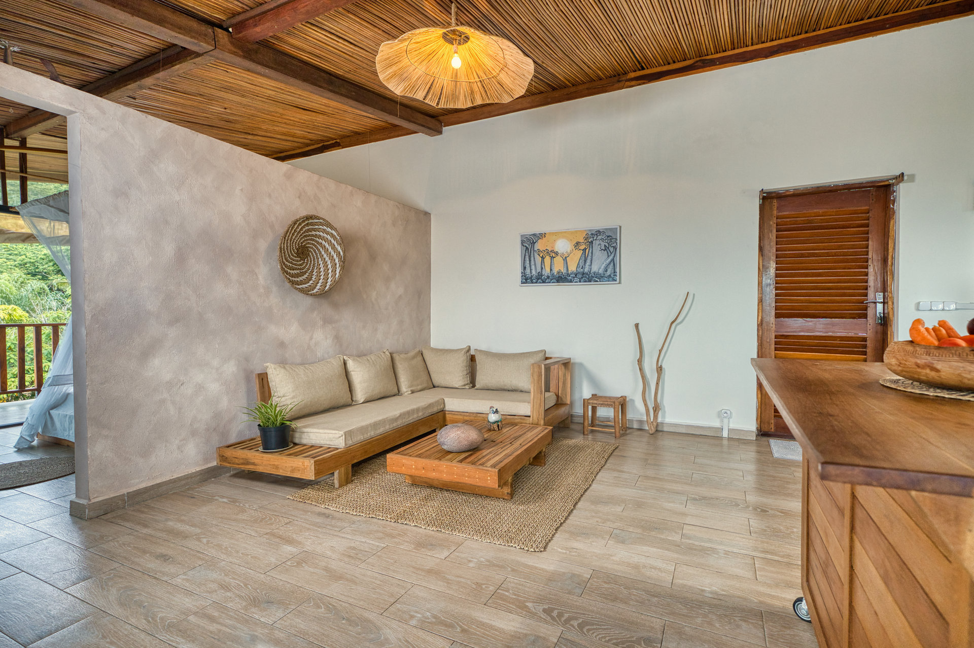 Superior Family Suite open lounge area with sofa, coffee table and ocean-view balcony